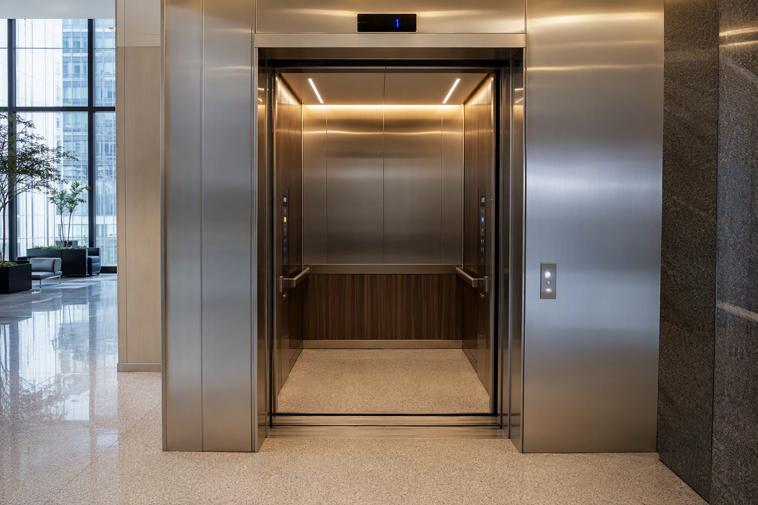 Modernized elevator cab interior in a Los Angeles commercial tower showing stainless steel walls, LED ceiling lighting, and updated fixtures after an independent elevator service upgrade.
