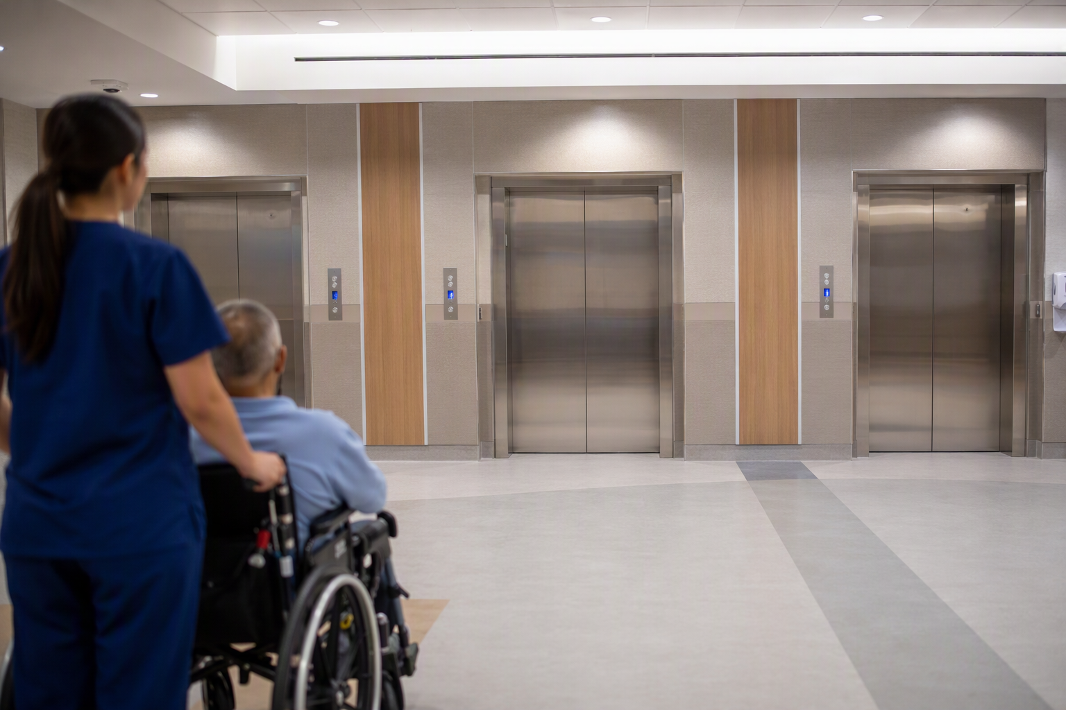Texas Healthcare Elevator Lobby Hospital elevator lobby in a Texas healthcare building showing ADA-compliant elevator doors and call buttons, relevant to Texas elevator code compliance in 2026